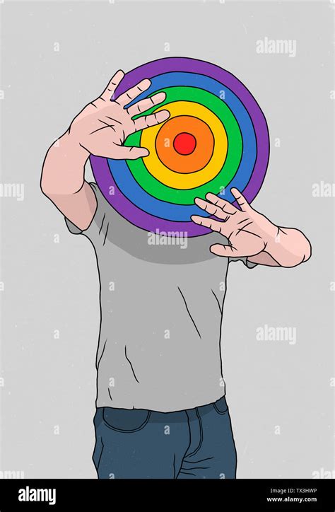 Man hiding behind rainbow dart board Stock Photo - Alamy