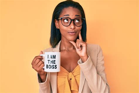 Young African American Woman Drinking Mug Of Coffe With I Am The Boss