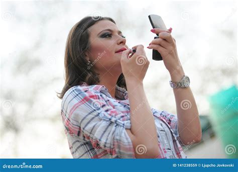 Beautiful Brunette Girl Puts Lipstick On The Her Lower Lip Of Yourself Stock Image Image Of