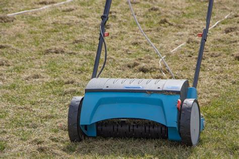 Gardener Operating Soil Aeration Machine on Grass Lawn Stock Image ...