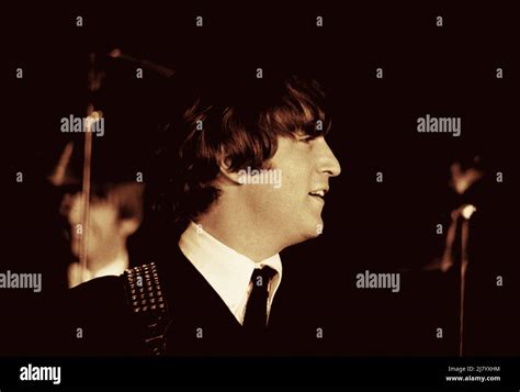 John Lennon With The Beatles 1964 Stock Photo Alamy