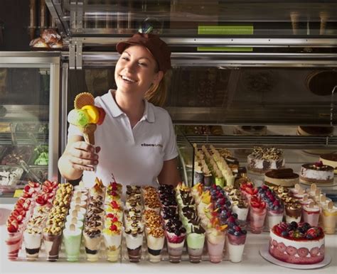 Smiling Saleswoman Selling Ice Cream Stock Photo Free Download