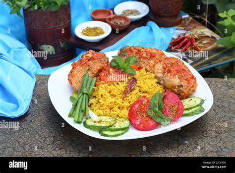 Fried fish in tomato sauce with basmati rice. Indian food Stock Photo ...