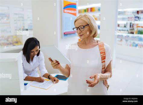 Cheerful Blonde Female Person Reading Her Notes Stock Photo Alamy