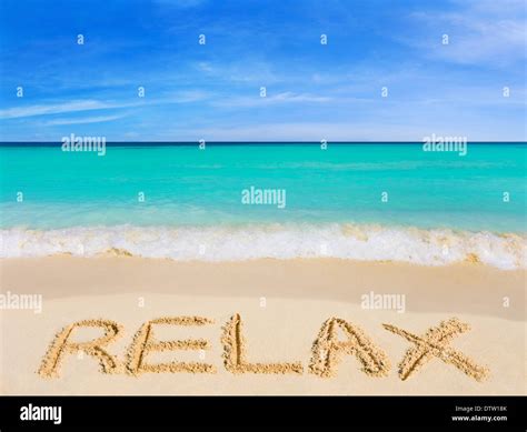 Word Relax on beach Stock Photo - Alamy