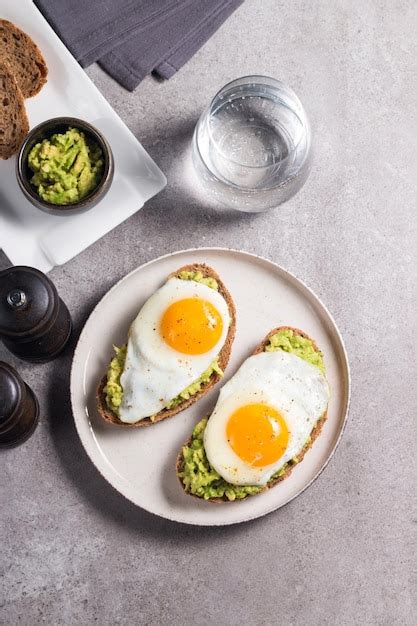 Premium Photo Avocado Egg Sandwich With A Glass Of Water Healthy