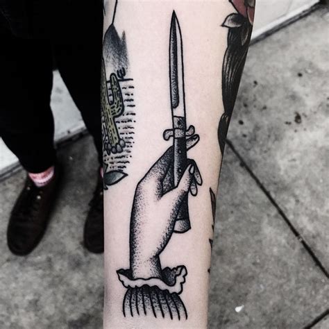 Small dagger tattoo on the arm - Tattoogrid.net