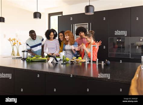 Happy Diverse Friends Cooking Together And Smiling In Kitchen Stock