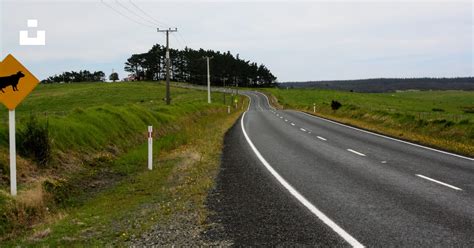 A road with a sign on it photo – Free Road side nature Image on Unsplash