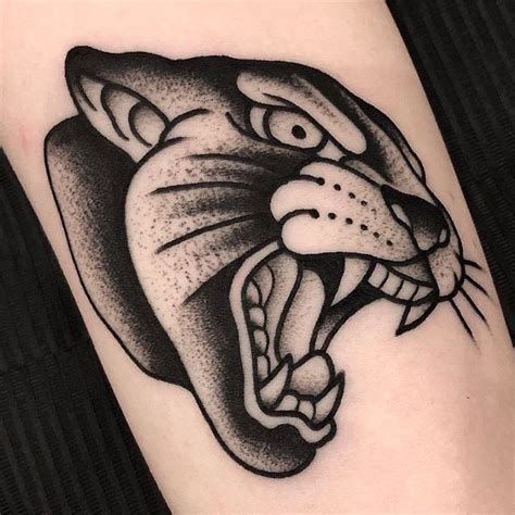 A Black And White Tiger Tattoo On The Right Arm With Its Mouth Wide Open