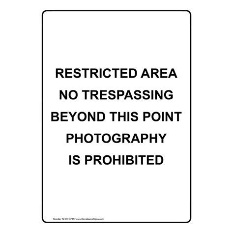 White Vertical Sign Restricted Area No Trespassing Beyond