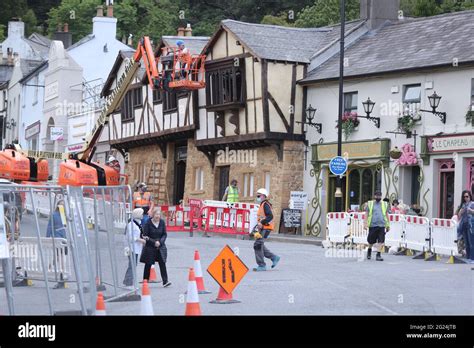 Local People Carry On With Daily Life Whilst Workers Transform