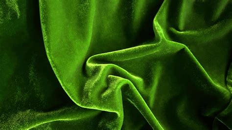 Green velvet fabric texture used as background. Empty green fabric ...