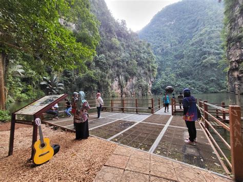 Tourists Enjoying Tranquil Scene In Tasik Cermin Ipoh Perak