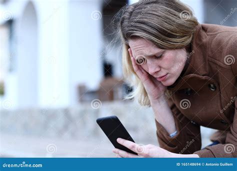 Sad Adult Woman Reading Bad News On Mobile Phone Stock Photo Image Of