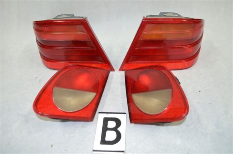 MERCEDES W210 LAMPA LAMPY TYŁ TYLNE KPL SEDAN 8561487086 oficjalne