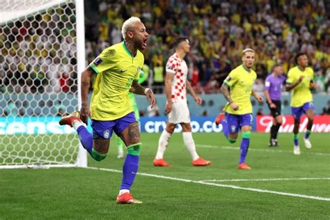 the soccer players are celebrating on the field