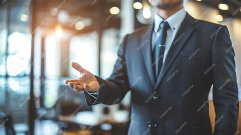 Premium Photo Confident Businessman In A Suit Reaching Out To Shake Hands