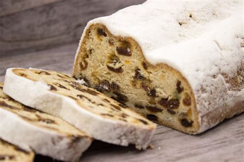 The Three Slices And The Main Part Of Stollen On A Wooden Background