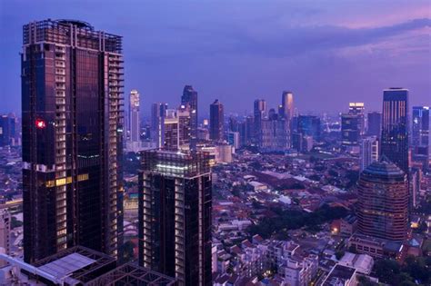 Premium Photo | Night view of two skyscrapers under construction