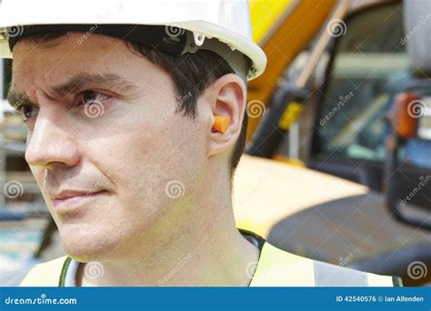 Oil Rig Worker Wearing Personal Protective Equipment Looking At