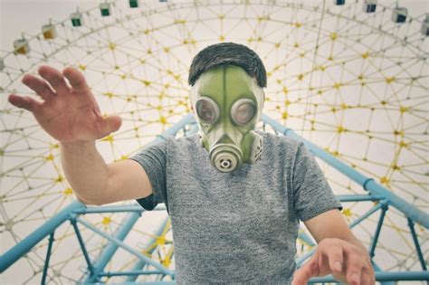 Premium Photo Low Angle Portrait Of Man Wearing Gas Mask Against