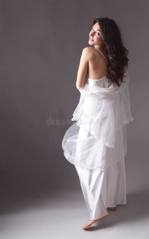 Beautiful Young Woman In Flowing Nightgown Royalty Free Stock Photos