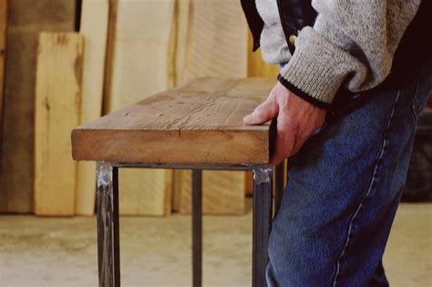 Premium Photo Midsection Of Man Holding Wooden Table