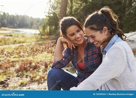 Happy Lesbian Couple Laughing Together In The Countryside Stock Image