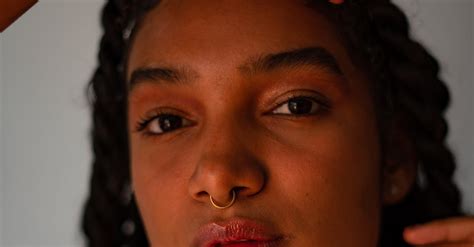 Close-up Portrait of a Young Woman with Braided Hair · Free Stock Photo