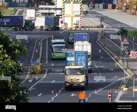 Port of Singapore, Containers Cargo truck transporting delivering Stock ...