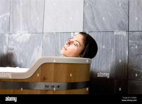 Woman Relaxing In Bathtub Stock Photo Alamy