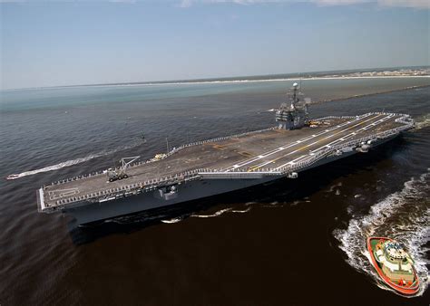 An Aerial Port Bow View Showing US Navy USN Sailors Manning The Rails