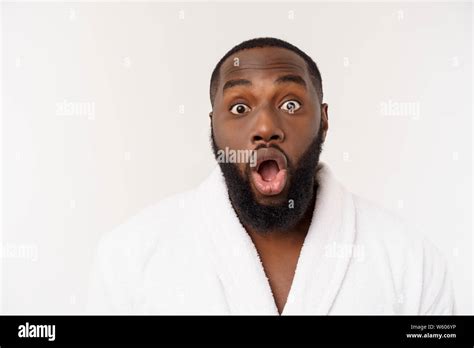 Portrait Of Excited Young African American Male Screaming In Shock And