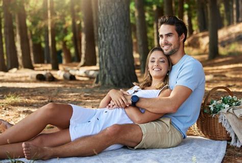 Premium Photo Couple In Nature Park Cuddle And Happy Relationship