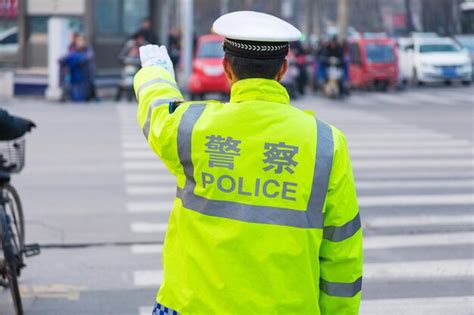 Premium Photo Rear View Of Traffic Cop Standing On Street