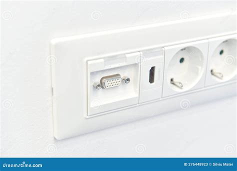 Detail View Of An Electrical Outlet With Hdmi Connection Mounted In