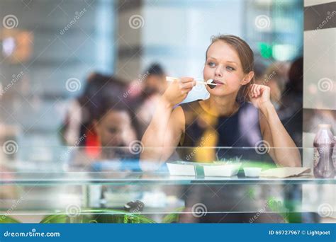 Pretty Young Woman Eating Sushi In A Restaurant Stock Image Image Of