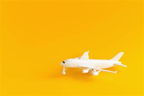 Plastic toy airplane on a yellow Background 3297964 Stock Photo at Vecteezy