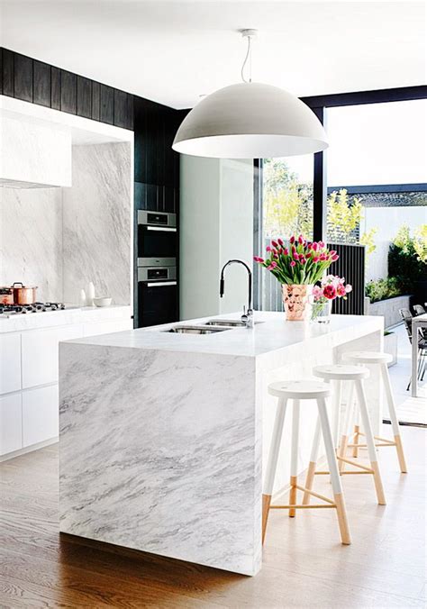 Marble Kitchen With Modern Light Fixture Beautiful Flowers And Wood