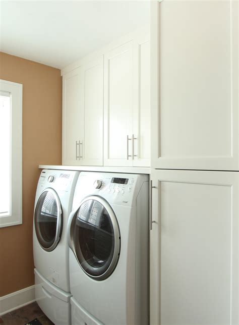 Washer Dryer On Pedestals Under Wood Countertop Transitional