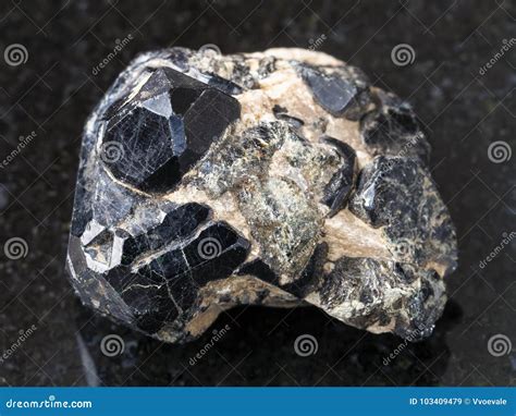 Raw Spinel Crystal On Black Diopside Crystals Stock Image Image Of