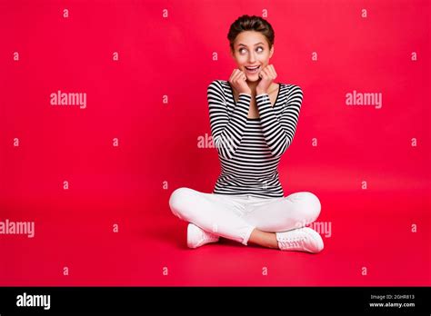 Photo Of Sweet Impressed Woman Dressed Striped Outfit Legs Crossed Arms