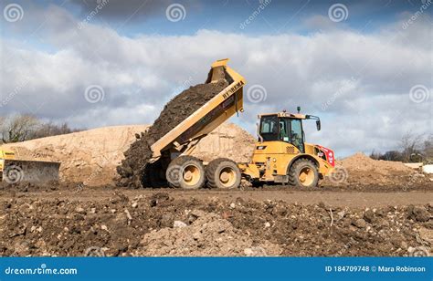 Industrial Dumper Truck Moving Tipping Earth On A Construction Site