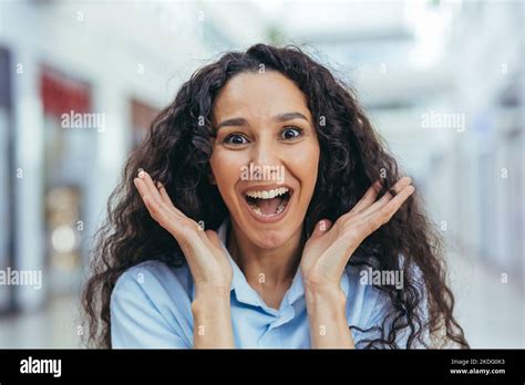 Close Up Portrait Of Female Shopper In Beehive Supermarket Hispanic