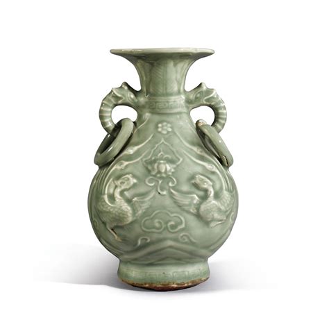 A Rare Longquan Celadon Glazed Dragon And Phoenix Vase Yuan