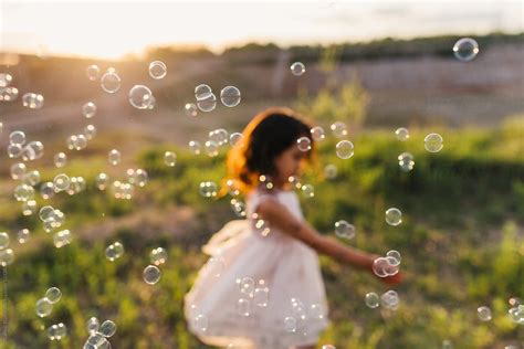 "Cute Little Girl Playing With Bubble" by Stocksy Contributor "MaaHoo ...