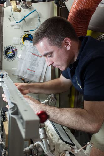 Chris Cassidy Works On A Spacesuit Iss E Aug Flickr