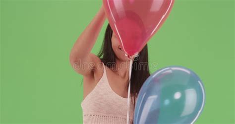 Millennial Latina With Lots Of Multicolored Balloons On Green Screen Stock Footage Video Of