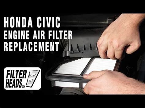 A Man Is Working On An Engine Air Filter For A Honda Civic Or Other Car